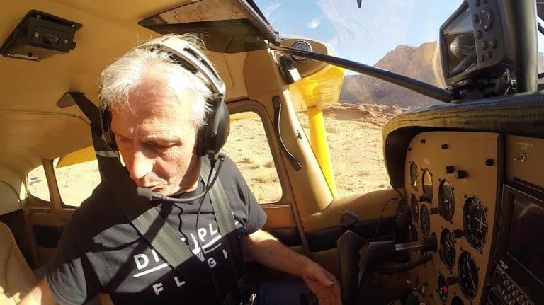Jim Hoddenbach arranging a Go Pro Camera - GoPro camera to make aviation video
