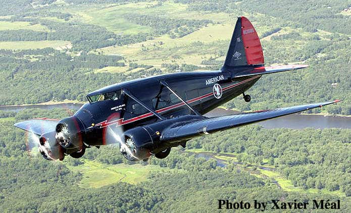 A restored Stinson Model A in flight.