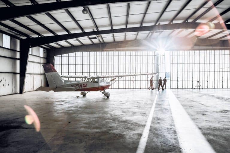 Pilots leaving a flight training school hangar - Are All Airline Pilot Training Schools the Same?